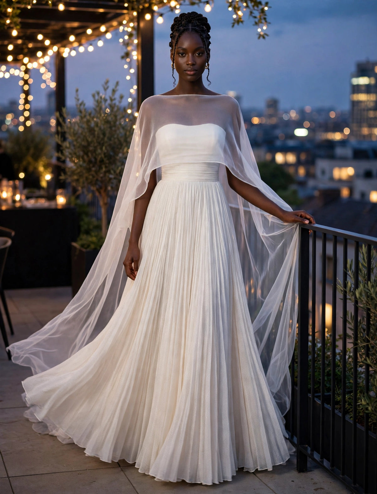 Elegant White Pleated Gown With Sheer Cape Overlay